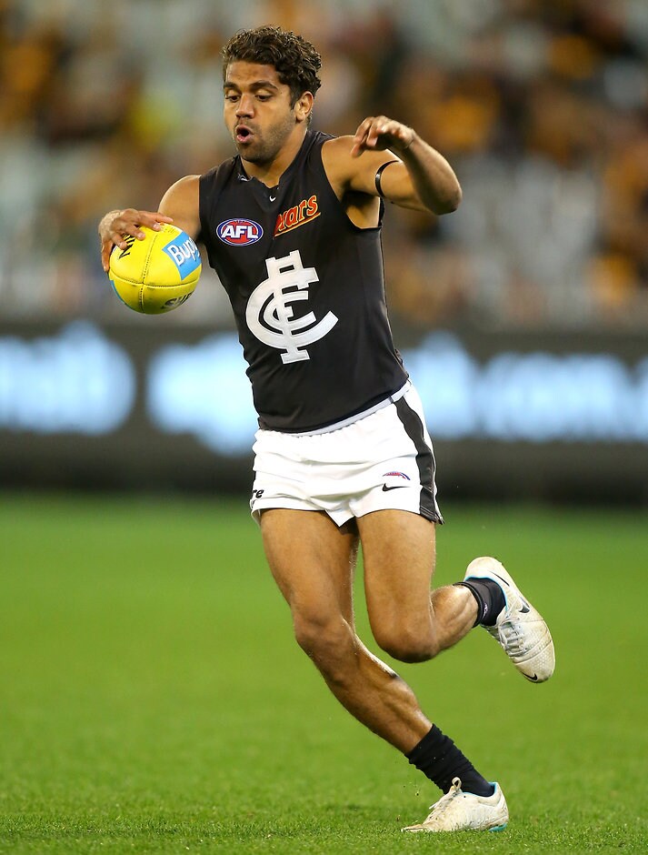 AFL 2015 Rd 23 - Hawthorn v Carlton MELBOURNE, AUSTRALIA - SEPTEMBER 5: Clem Smith of the Blues kicks ahead during the 2015 AFL round 23 match between the Hawthorn Hawks and the Carlton Blues at the Melbourne Cricket Ground, Melbourne, Australia on September 5, 2015. (Photo by Justine Walker/AFL Media)